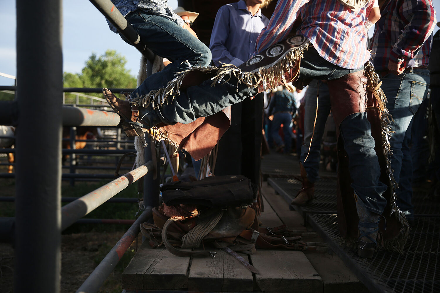 A rough stock rider shows off his chaps
